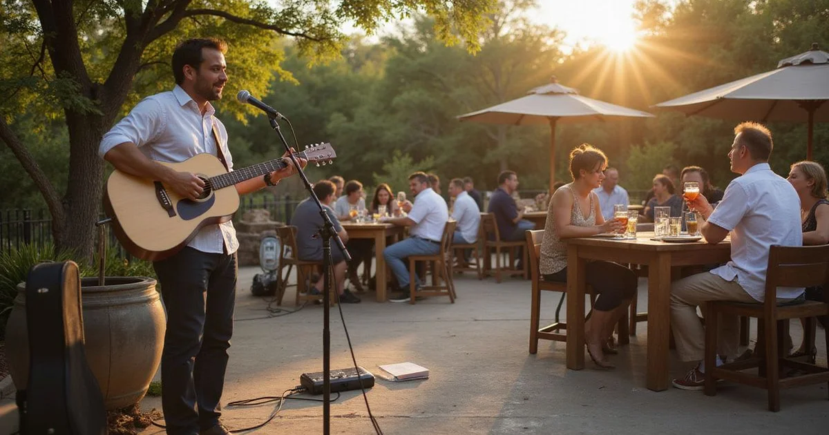 A solo guitarist playing at an outdoor wedding cocktail hour